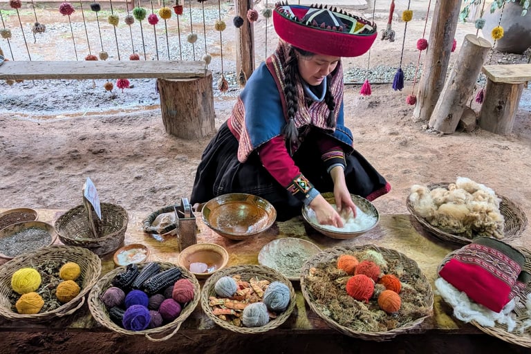 Woman in traditional clothing dyeing yarn or fabric with natural materials in bowls at an outdoor market stall